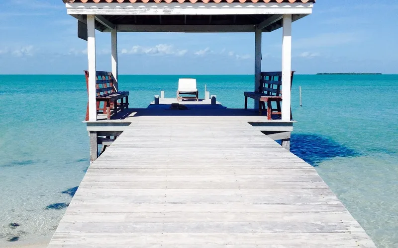 Wooden beach cabanas on Caye Caulker Belize, a short walk from the caye caulker belize snorkeling docks